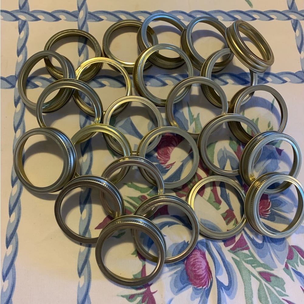 24 gold tone regular canning jar rings.